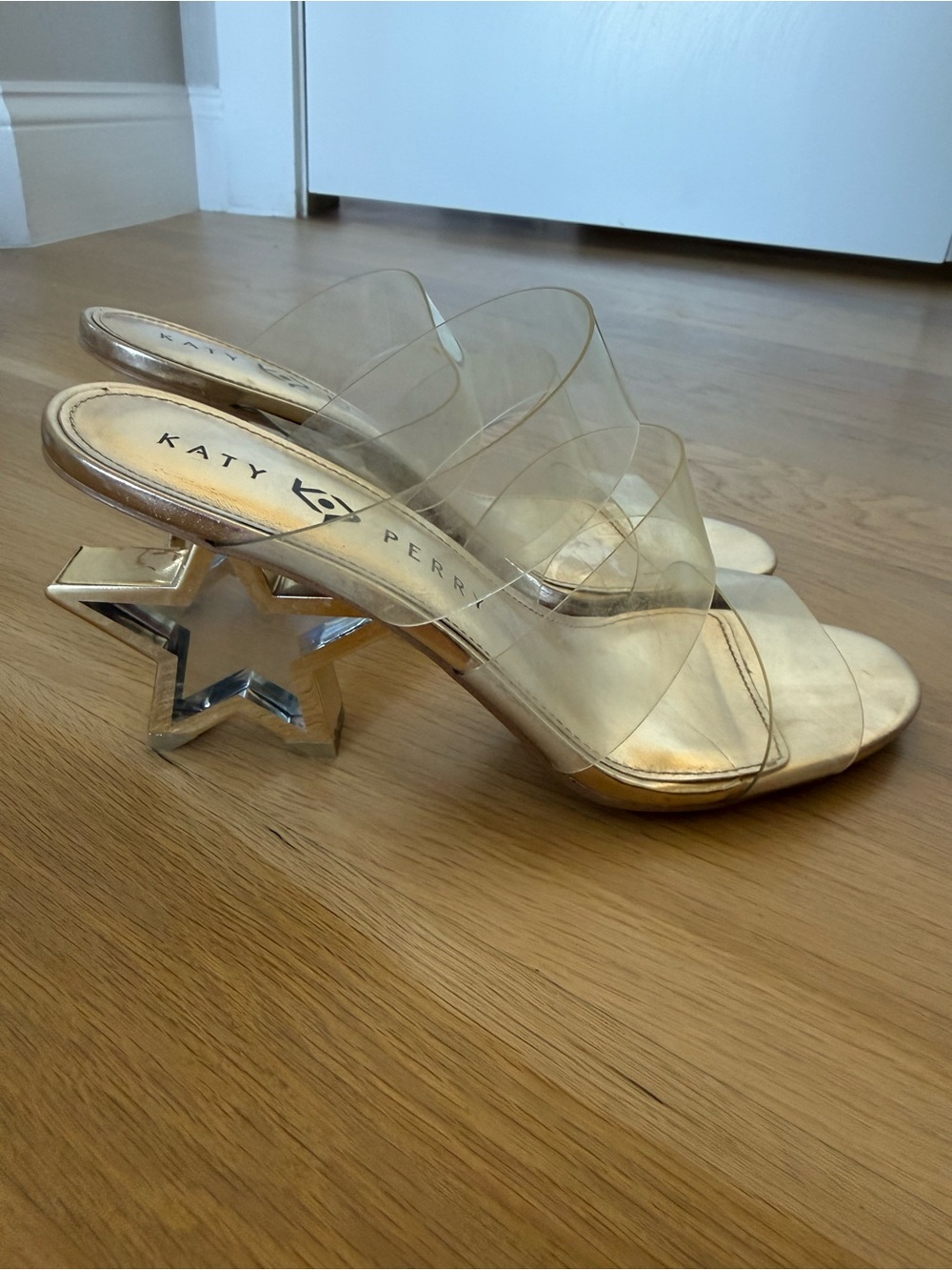 Katy Perry Collections Clear PVC Slide Sandals with Gold Footbed and Star Heel